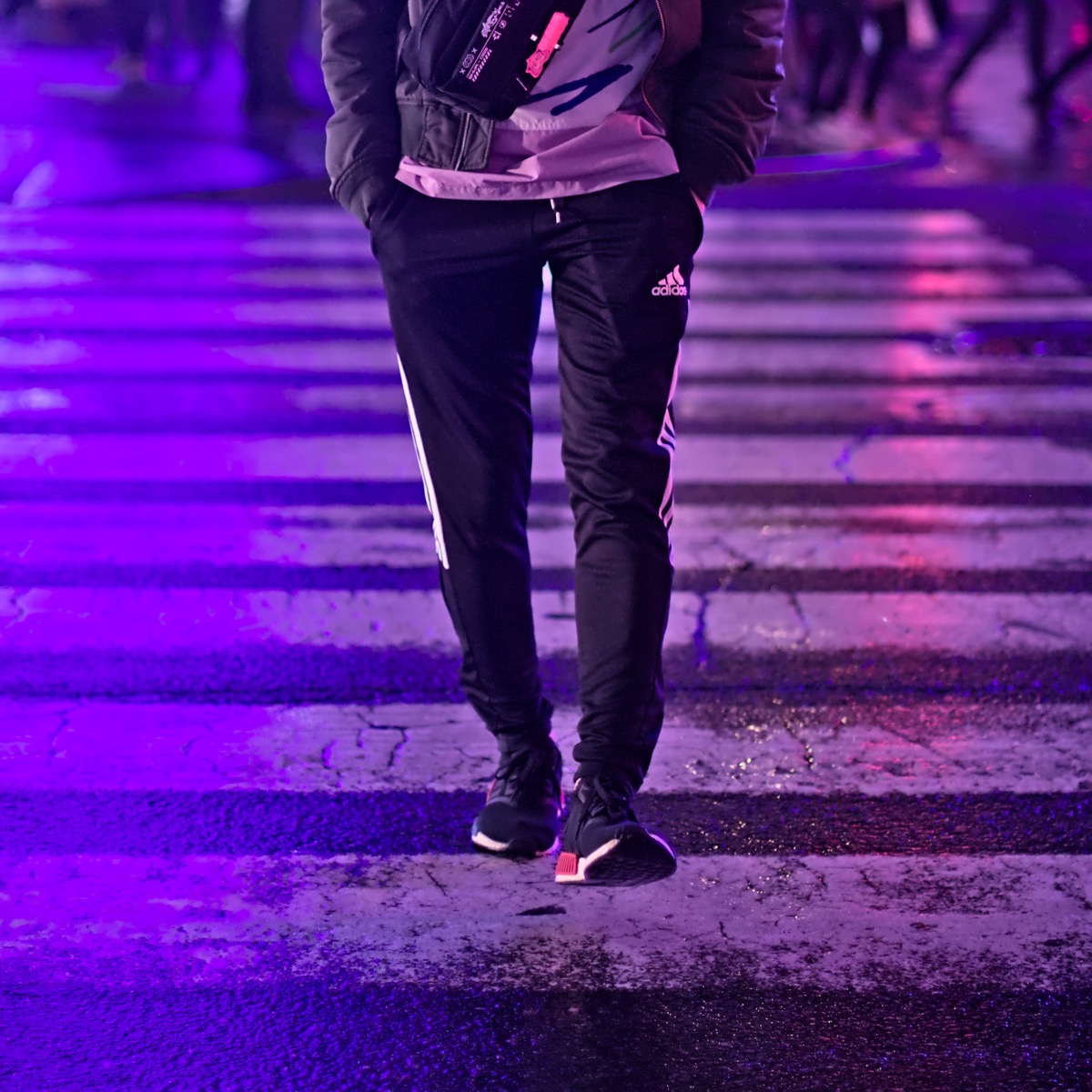 Brandon walking across a street